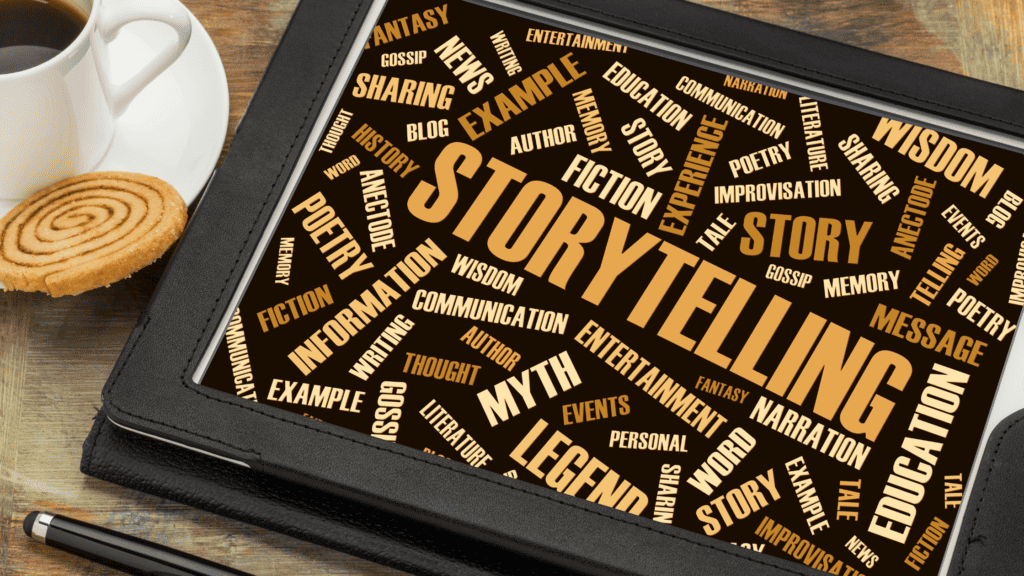 A digital tablet displaying a word cloud centered around "storytelling," surrounded by related terms like "fiction," "myth," and "wisdom." A coffee cup and a cookie are beside the tablet on a wooden surface, illustrating social media marketing strategies for clothing brands.