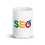 A SEO White Glossy Mug with the acronym "seo" printed in bold, colorful letters—green 's', yellow 'e', and red 'o' with a blue rocket icon incorporated into the 'o', all positioned on a plain white background.