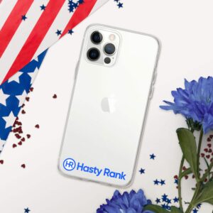 A HR CrystalShield iPhone® Case with the apple logo and a "hasty rank" sticker on a white background, partially covered by an american flag and scattered red confetti, next to blue flowers.
