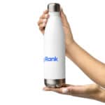 Two hands holding a white HR Elite Hydration Flask with a silver base and cap, featuring a "myrank" logo in blue text. the background is plain white, emphasizing the bottle.