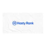 A white rectangular HR Signature Towel with the "hasty rank" logo centered in blue. the logo features the letters "hr" enclosed in a circle, with "hasty rank" written below it. the towel has visible folds.