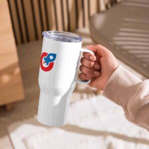 A person's hand holding a white SEO travel mug with a handle, featuring a colorful geometric logo. the mug has a clear lid and is photographed indoors with a wooden background.