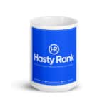 HR Cheerful Brew Mug with a blue label featuring the "hasty rank" logo in white and gray text, described as a "full-service digital marketing & website design company", along with contact details below.