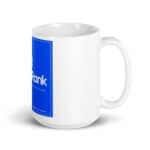 A white ceramic HR Cheerful Brew Mug with a large blue label featuring the word "qrank" in white letters. the label also contains smaller text reading "your favorite drink company." the mug is shown on a plain white background.